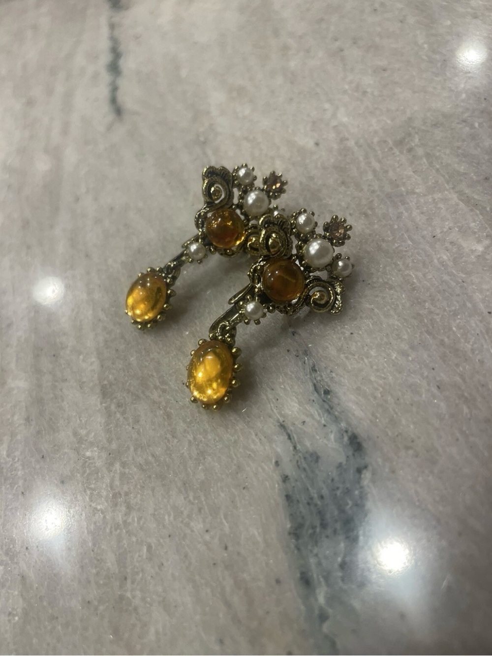 vintage gold tone pearl clip-on earrings featuring amber glass stones